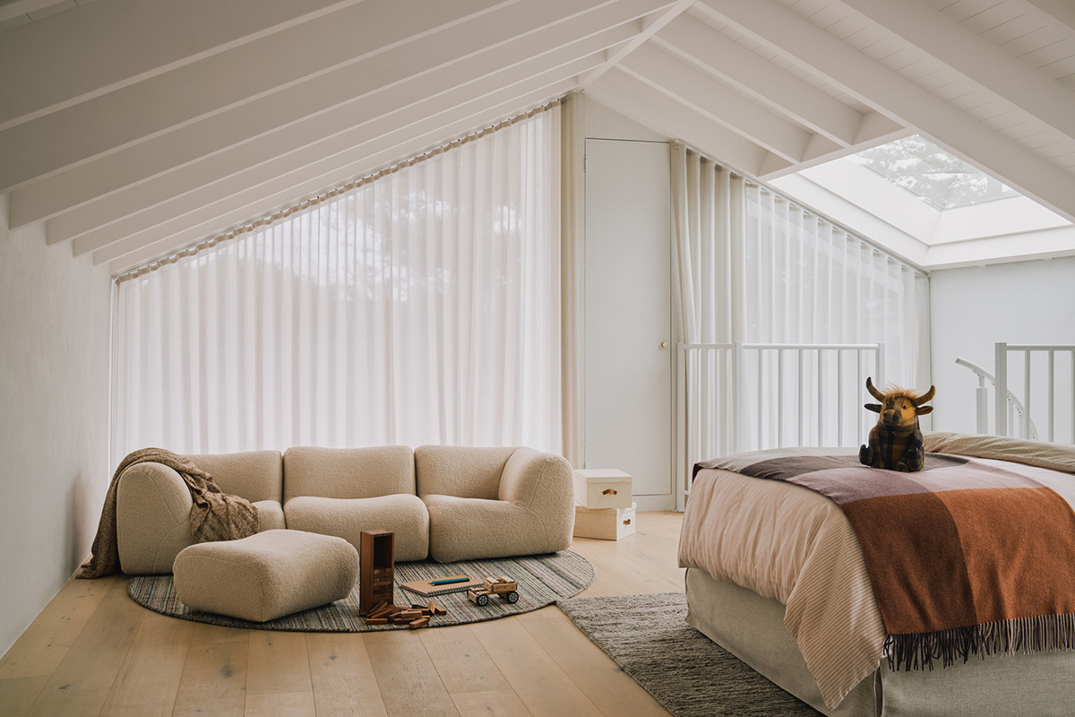 Kids’ bedroom furniture featuring a children’s play sofa, styled in a bright and modern loft space.