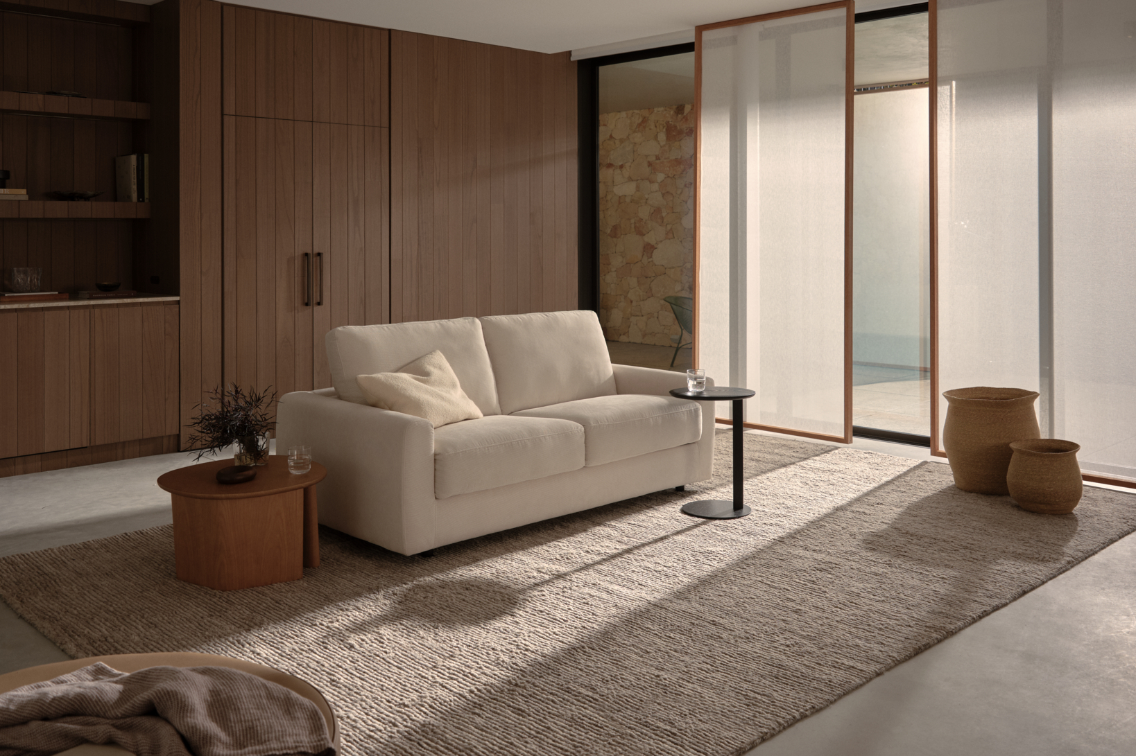 A modern neutral sofa bed in a contemporary living room